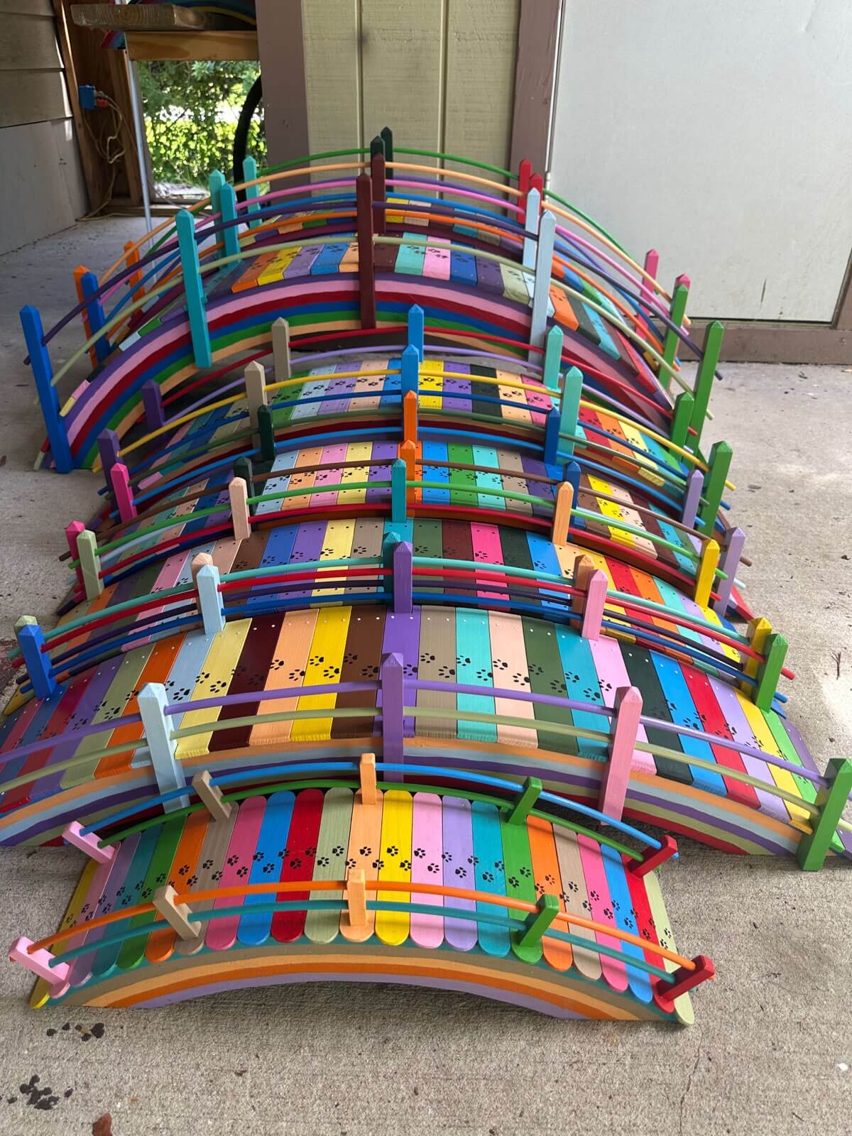 Paul's rainbow bridges lined up showing the arched design and colorful painted slats