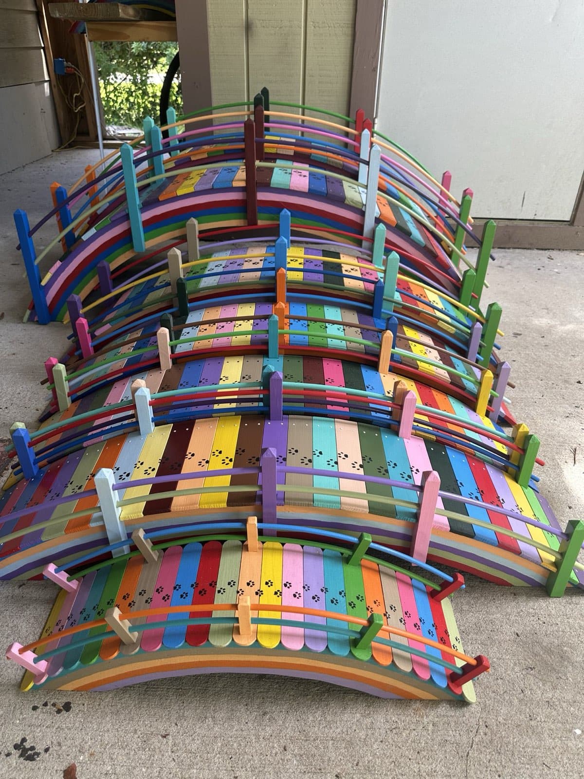 A range of Paul Allabaugh's handcrafted Rainbow Bridges shown together — small, medium, and large sizes side by side