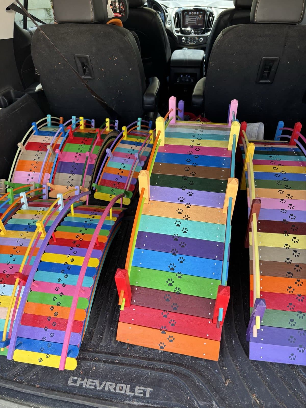Small and medium Rainbow Bridges from Paul Allabaugh's workshop, loaded into a vehicle for delivery