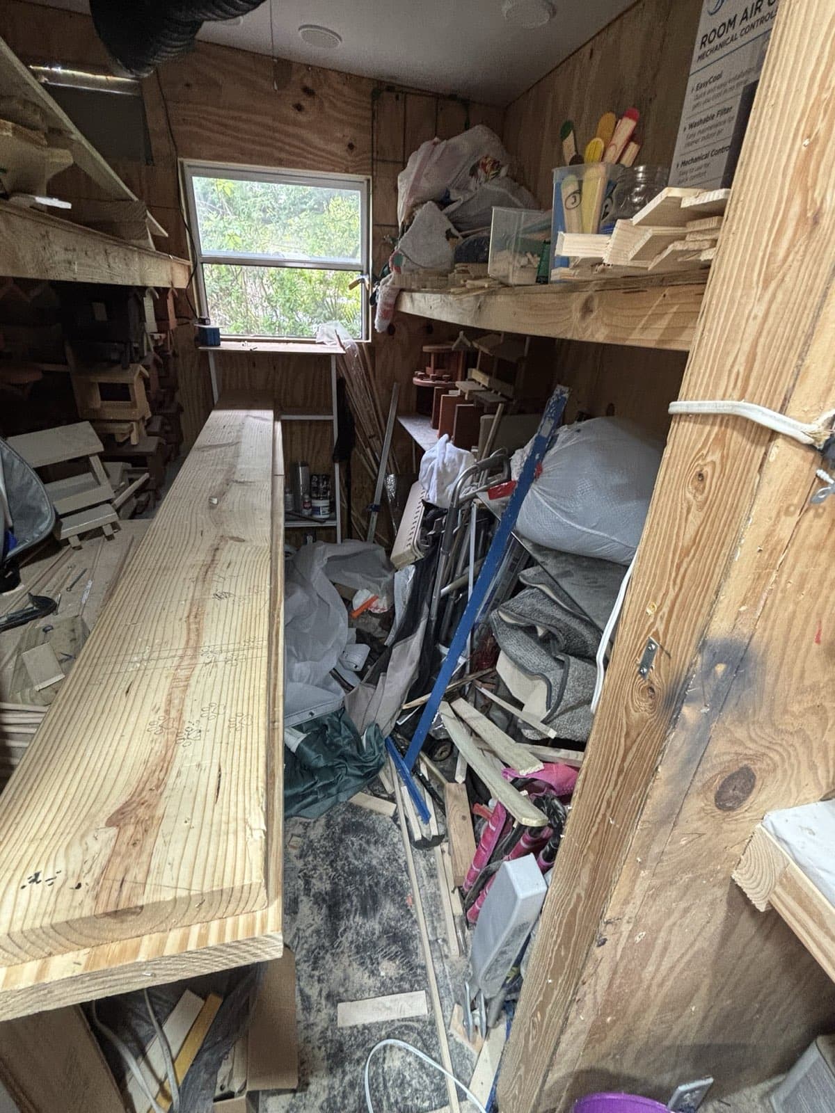 Storage racks inside Paul Allabaugh's workshop, holding finished pieces ready for new homes